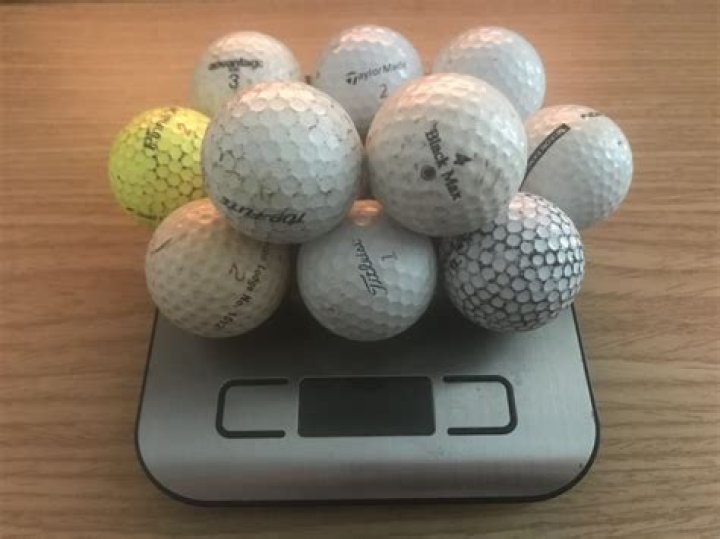 how much does a dozen golf balls weigh