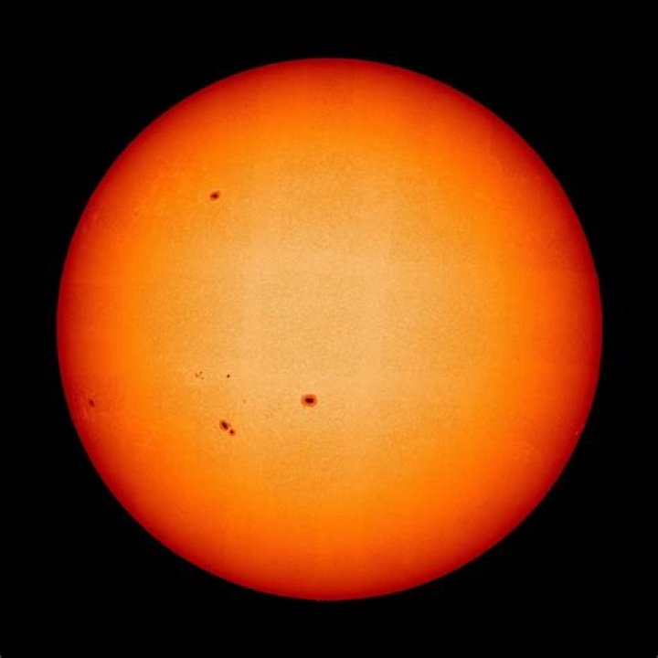 what are the dark areas on the surface of the sun?
