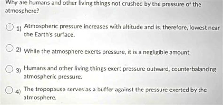why are humans and other living things not crushed by the pressure of the atmosphere?